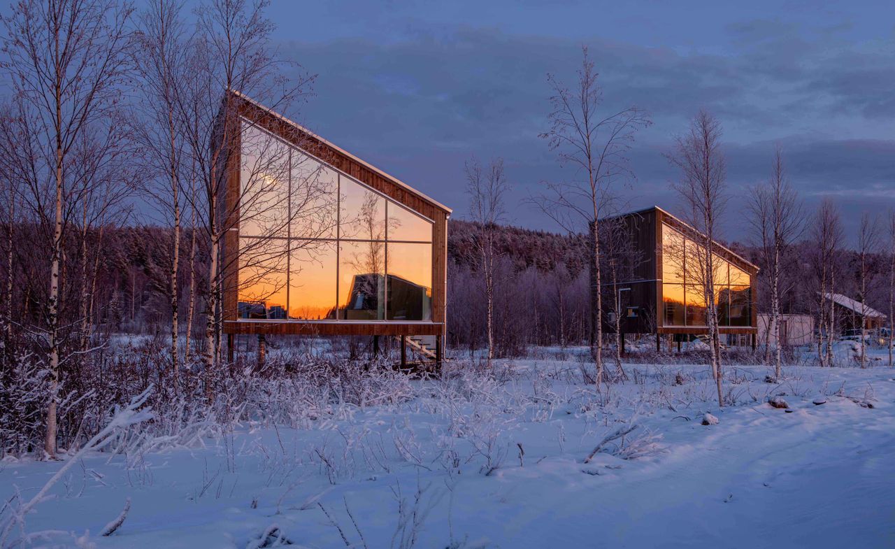 An outside view of a the cabins at Arctic Bath — Lapland, Sweden