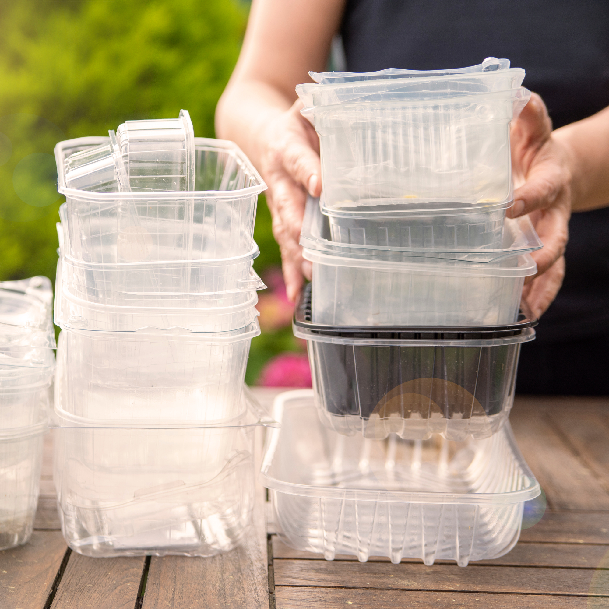 woman stacking takeout containers