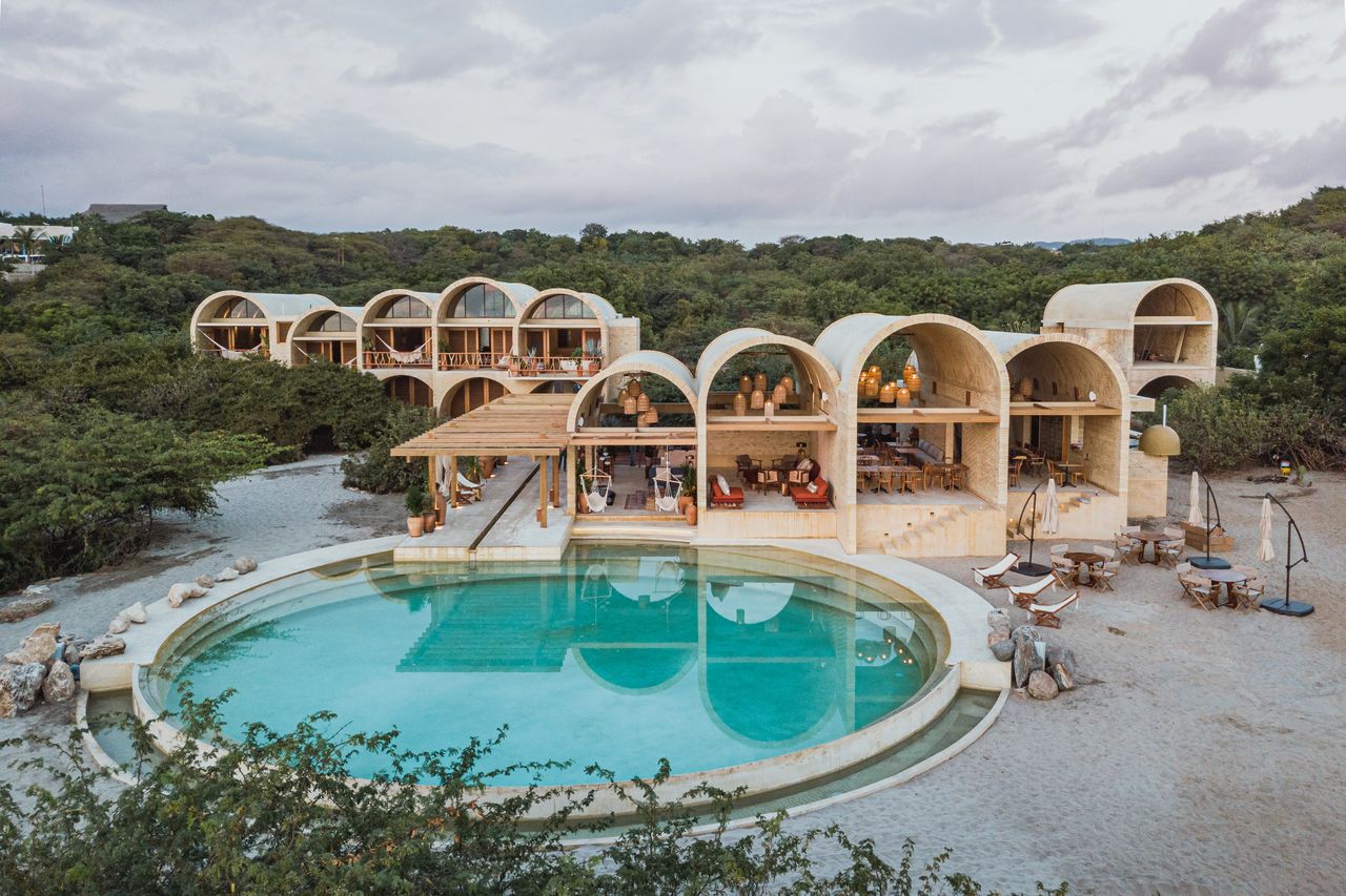 View of a pool from the outside of the hotel