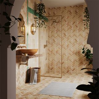 A bathroom with floor to ceiling matching tiles and a walk-in shower