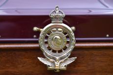 An old RAC (Royal Automobile Club) brass badge on 1911 Renault CC