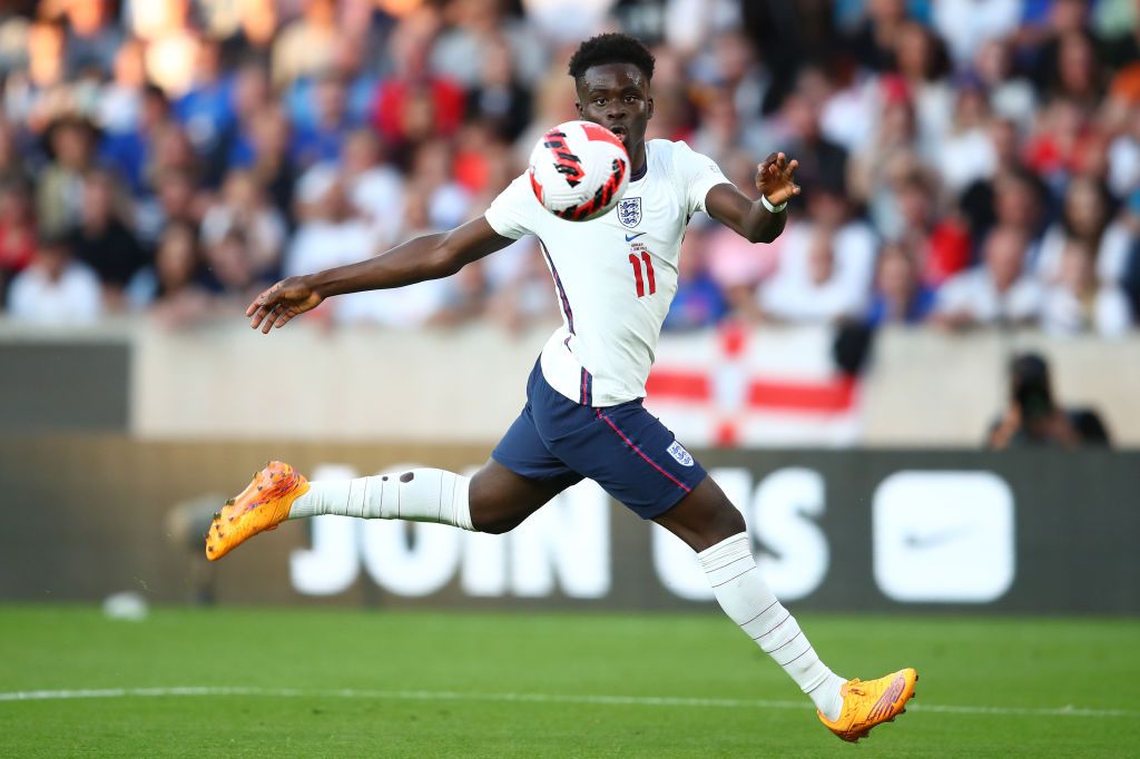 Bukayo Saka in action for England against Hungary, wearing New Balance Furon V6+ boots