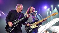 Alex Lifeson (left) and Geddy Lee perform onstage with Rush in 2013