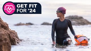 Woman open water swim with buoy