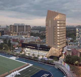 University of Toronto wood tower by Patkau Architects and MJMA. A large building next to a sports stadium with a running track around a field.