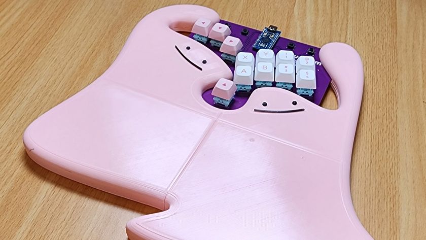 Rudeism&#039;s Rudebox custom fighting pad on a desk with wrist rest depicting two dittos 