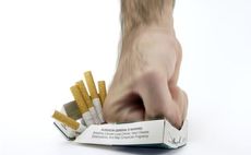 Hand smashing cigarettes