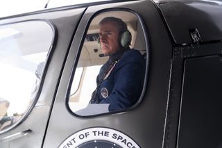 Gen. Naird flies in a helicopter in Netflix's new comedy "Space Force."