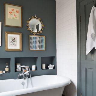 Bathroom with dark grey-green wall with alcoves