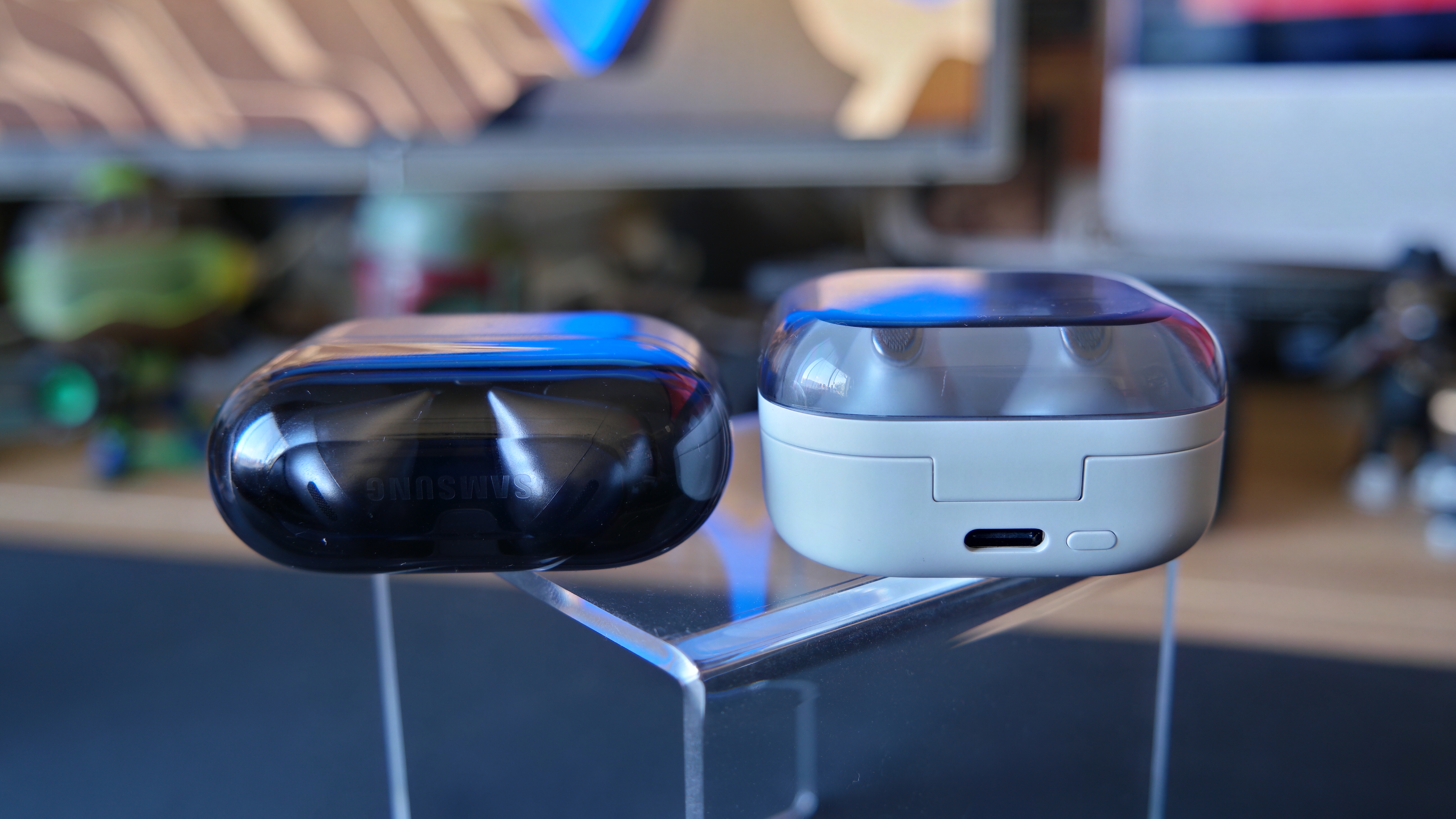 Galaxy Buds 4 Pro on a desk, next to Galaxy Buds3 Pro