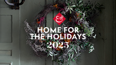 Christmas wreath with 'home for the holidays' written in front