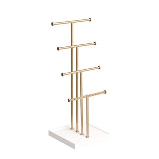 A gold and white jewelry stand