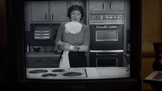 Julia Child flips an omelet on TV in Julie & Julia