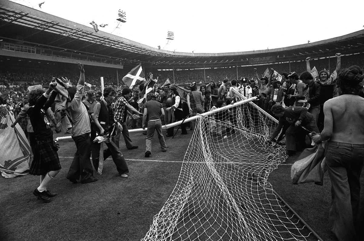 SCOTLAND FANS TEAR DOWN GOALPOSTS