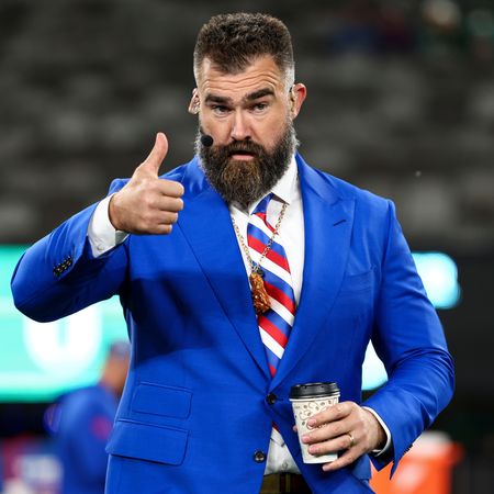 Jason Kelce jokes about his meeting with Princess Charlotte and Prince George and the royal protocol issue he didn't know how to follow, he's pictured wearing a royal blue suit and doing thumbs up