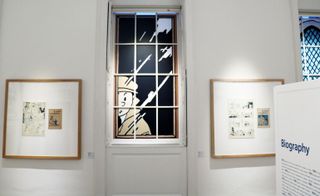 Windows are a ubiquitous theme: seen in the appropriated endpapers; in the models and maquettes; and strewn across the museum’s actual windows, as vivid scenes set in vinyl