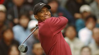 Tiger Woods takes a shot in the 2002 Dunlop Phoenix Golf Tournament