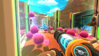 Slimes in a pen, recoiling from the grabber in Slime Rancher