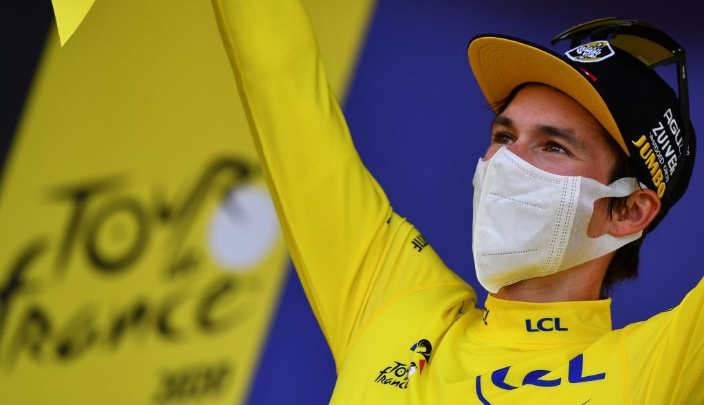 Team Jumbo rider Slovenias Primoz Roglic celebrates his overall leader yellow jersey on the podium at the end of the 16th stage of the 107th edition of the Tour de France cycling race 164 km between La Tour du Pin and VillarddeLans on September 15 2020 Photo by Stuart Franklin various sources AFP Photo by STUART FRANKLINAFP via Getty Images