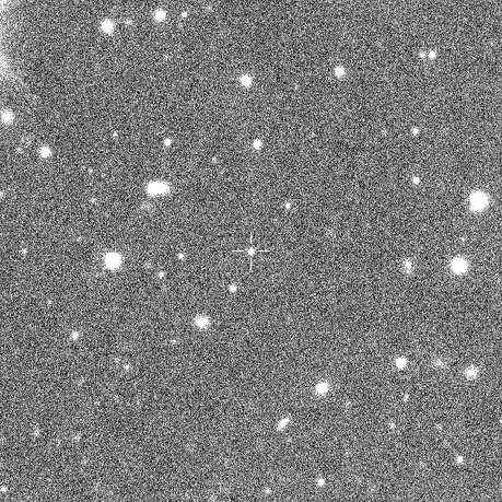 black and white, grainy image of deep space, showing several dozen fuzzy points of light