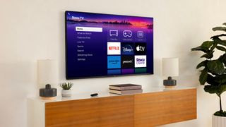 Roku Pro series TV mounted to wall in living room