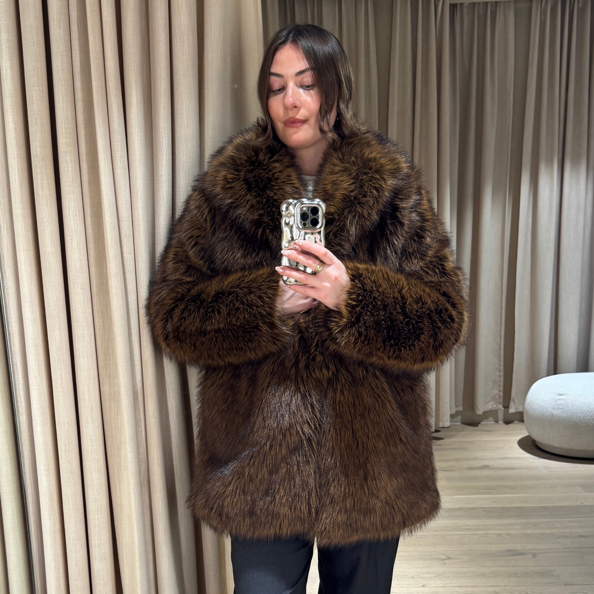 Sophie Robyn Watson wearing an fluffy brown H&M coat.