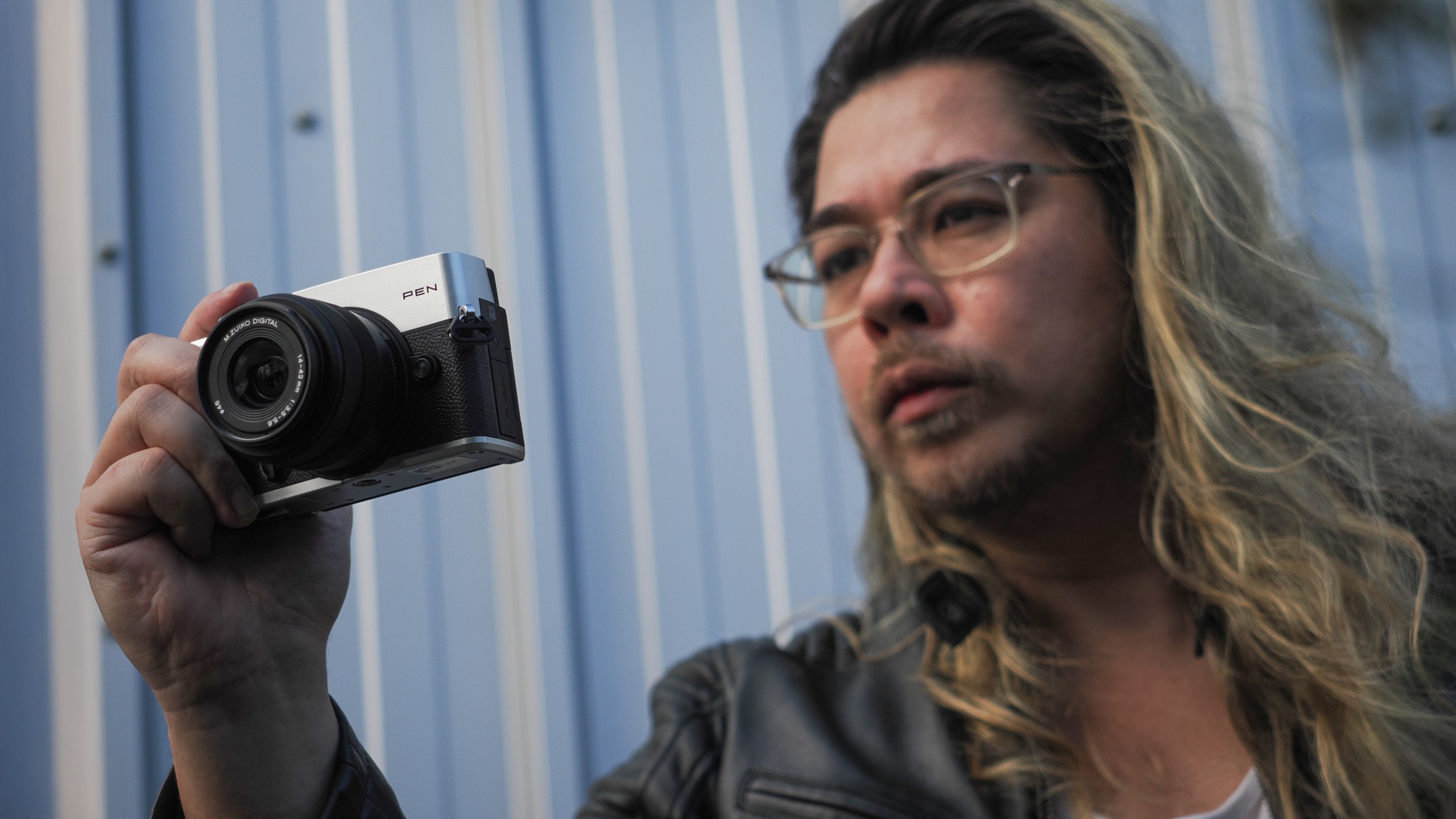 James Artaius shooting with the OM System PEN and the OM System M.Zuiko 14-42mm f/3.5-5.6 III in an urban setting