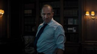 Ralph Fiennes looking angry in his office in No Time To Die.