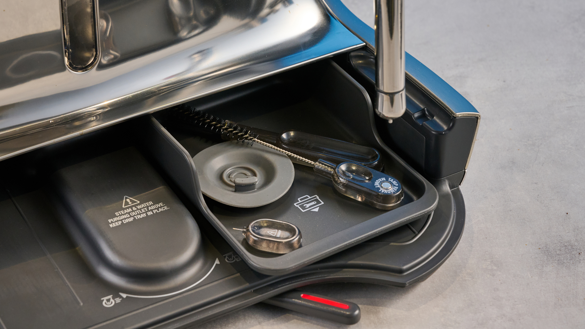 the breville oracle dual boiler / sage oracle dual boiler in stainless steel, showing its touchscreen, steam wand, built in grinder, and espresso shots