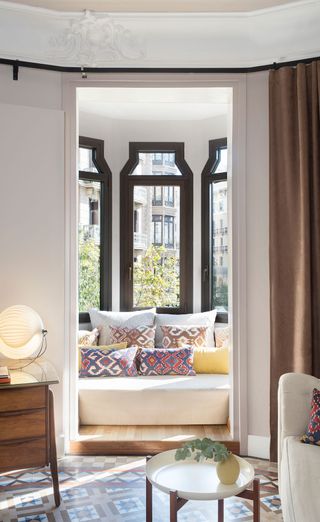 Sofa in window cove of guestroom