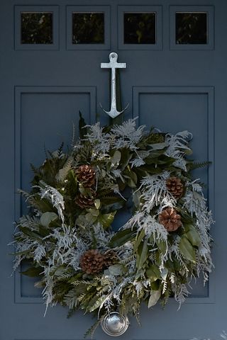 door with christmas wreath and anchor door knocker