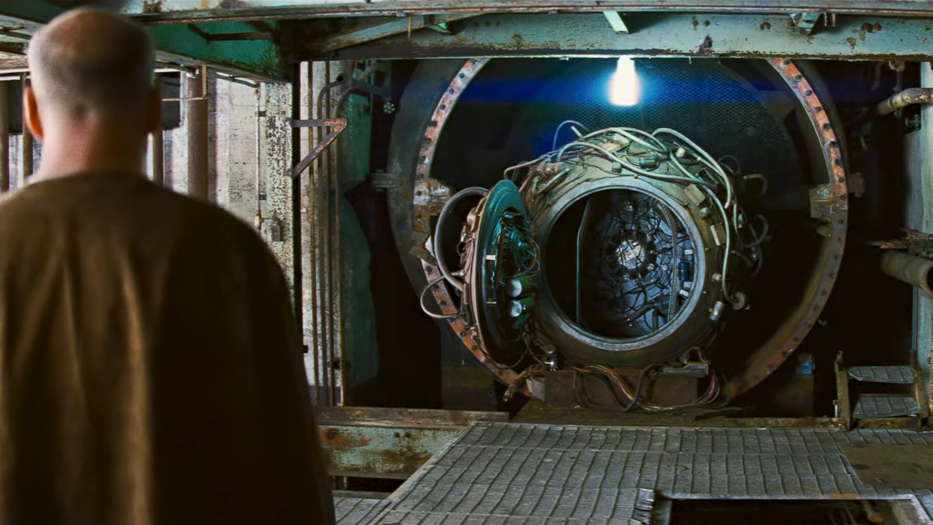 Bruce Willis's character Joe looking at the time machine from the movie Looper.