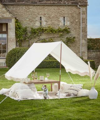 fringed canopy shelter on lawn from Cox & Cox