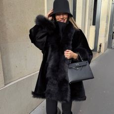 woman wearing leggings with boots outfit 2026