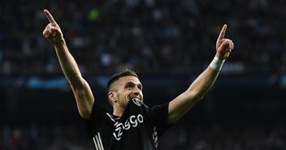 Dusan Tadic of Ajax celebrates after scoring his team's third goal during the UEFA Champions League Round of 16 Second Leg match between Real Madrid and Ajax at Bernabeu on March 05, 2019 in Madrid, Spain.