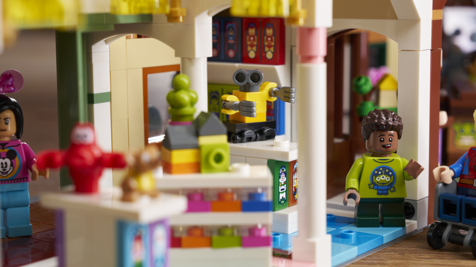 Lego Main Street USA items on shelves, with minifigures visible amongst them