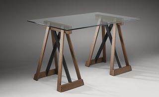 The house's oak 'Sawhorse Table', topped with thick glass