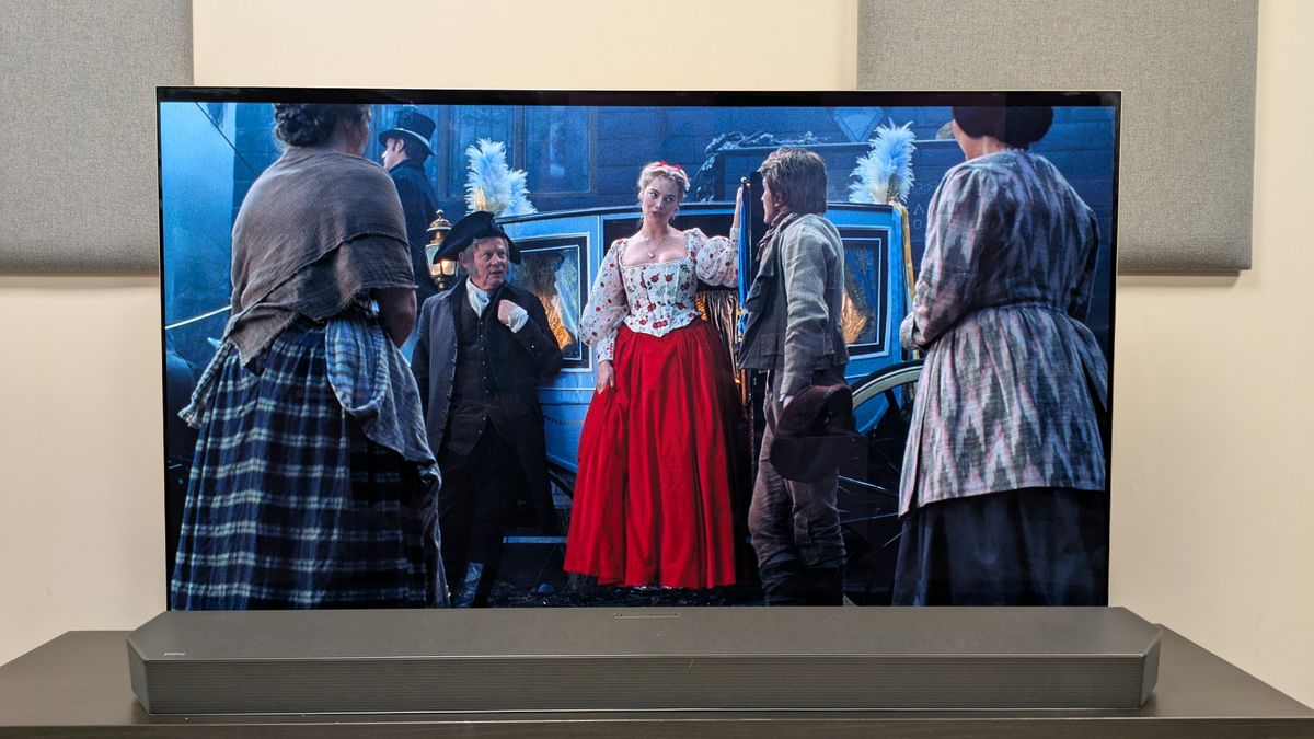 "Wuthering Heights" 4K Blu-ray showing Cathy in a bright red dress coming out of a carriage, shown on an LG G5 OLED