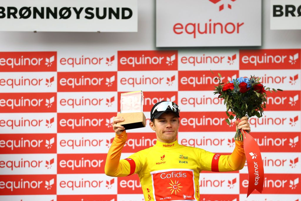 BRONNOYSUND NORWAY AUGUST 12 Axel Zingle of France and Team Cofidis Yellow Leader Jersey celebrates at podium during the 9th Arctic Race Of Norway 2022 Stage 2 a 1543km stage from Mosjen to Brnnysund ArcticRace on August 12 2022 in Bronnoysund Norway Photo by Michael SteeleGetty Images