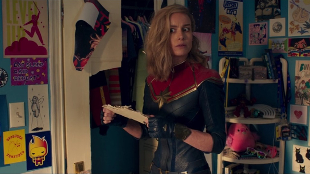 A shocked Captain Marvel looks around Kamala Khan's room after they switch places in the post-credits scene of Miss Marvel Episode 6