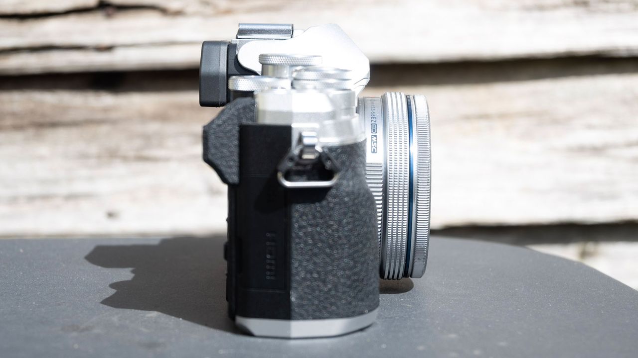 Olympus OM-D E-M10 Mark IV side view with screen tucked in