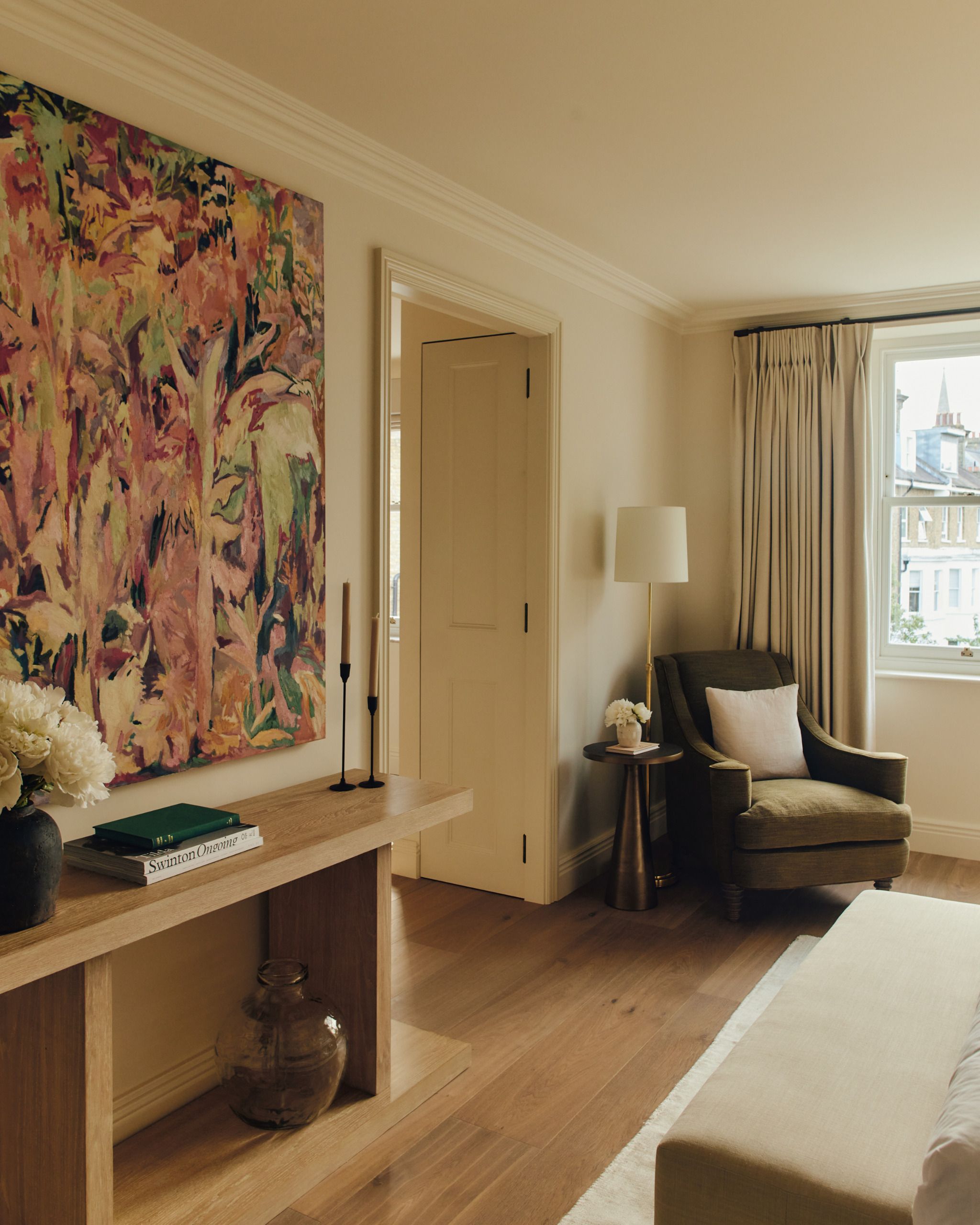 guest bedroom with armchair and console table