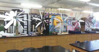  Middle school girls build and test turbines. 