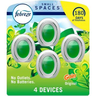 Febreze Small Space air freshener in a multipack of four with green liquid inside the cone