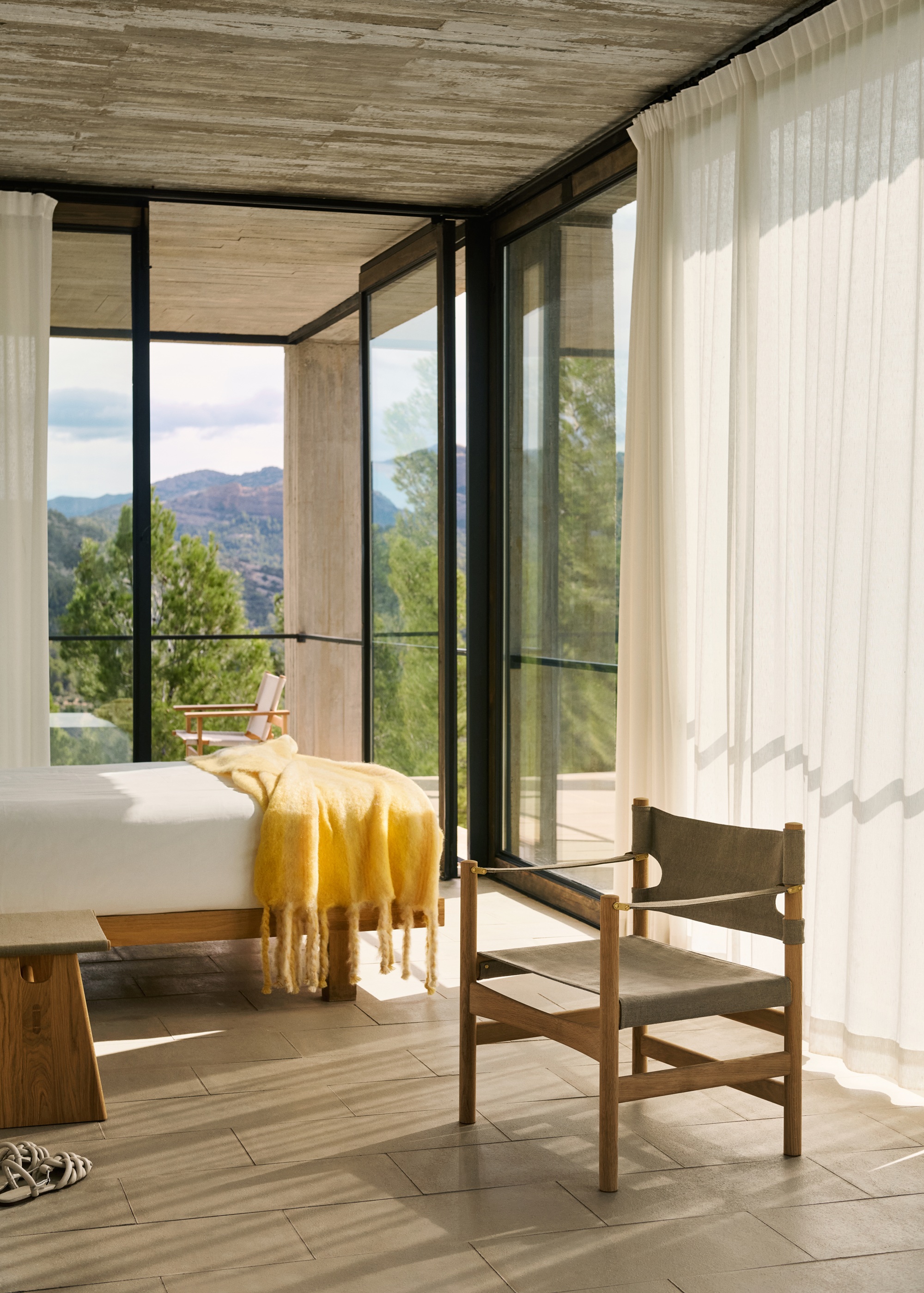 fredericia canvas chair in a light and airy bedroom