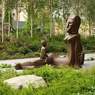 garden area with sculpture and trees