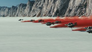 A battle on the planet of Crait takes place amidst a salt flat that reveals a red crystal under the surface