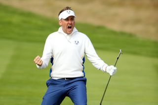 Ian Poulter celebrates holing a chip shot at the Ryder Cup