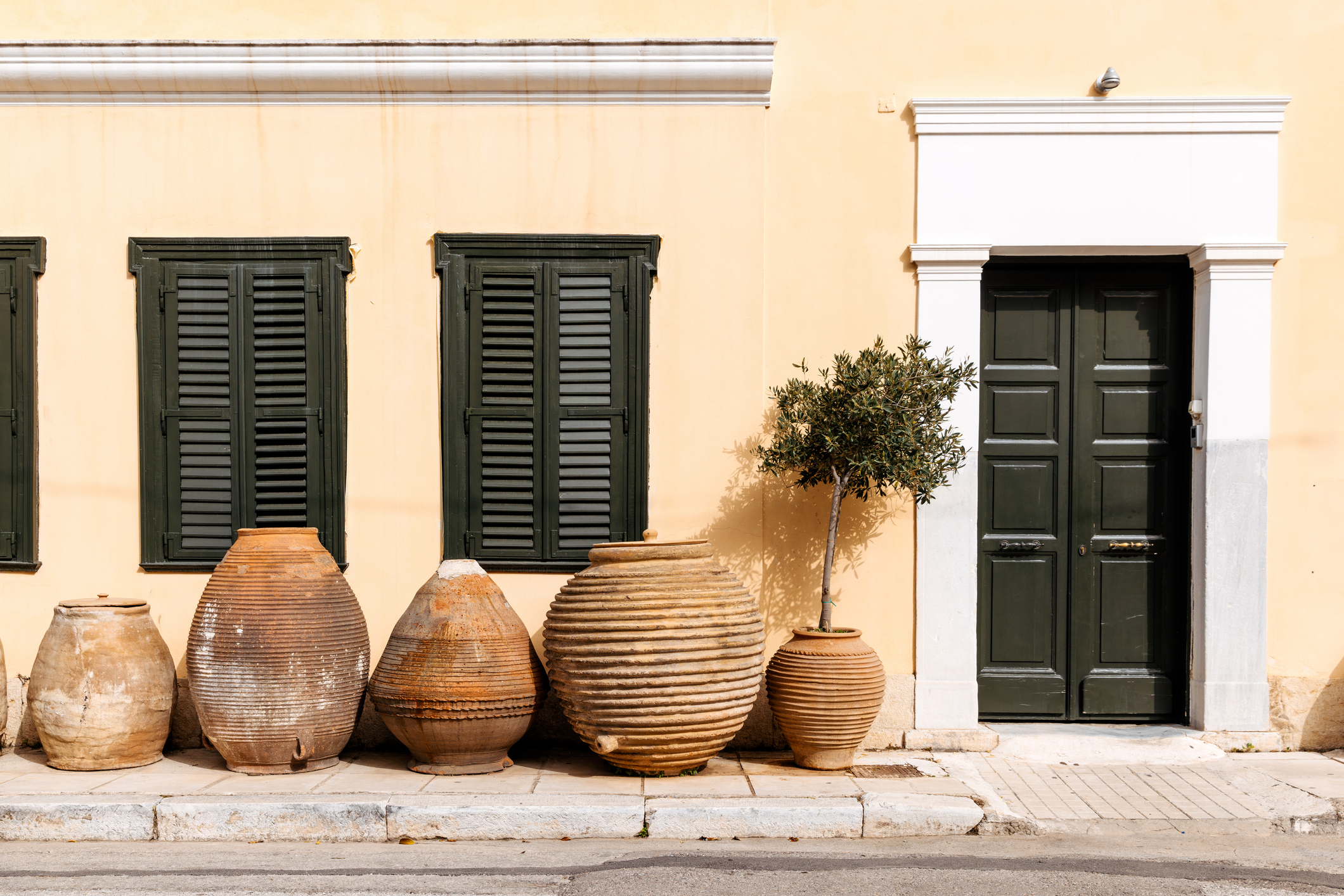 Traditional Greek clay amphoras and pots on the streets of Athens, Greece