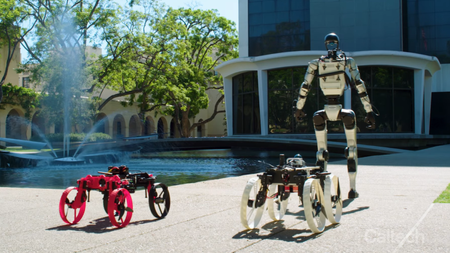 Humanoid robot with two drones driving on the pavement in front. 